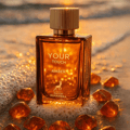 Maison Alhambra Your Touch Amber by Maison Alhambra 100ml — A rectangular amber glass perfume bottle with a gold ribbed cap sits next to its matching gold and orange box, which features a zipper-like design. | Maison Alhambra Your Touch Amber by Maison Alhambra 100ml — Botol kaca amber berbentuk segi empat dengan