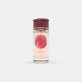 Maison Alhambra Camille by Maison Alhambra 100ml EDP — A clear glass perfume bottle with a rose-shaped maroon cap and a maroon rose design on the front, next to its matching maroon box with gold accents and text. | Maison Alhambra Camille by Maison Alhambra 100ml EDP — Botol minyak wangi kaca jernih dengan penutup