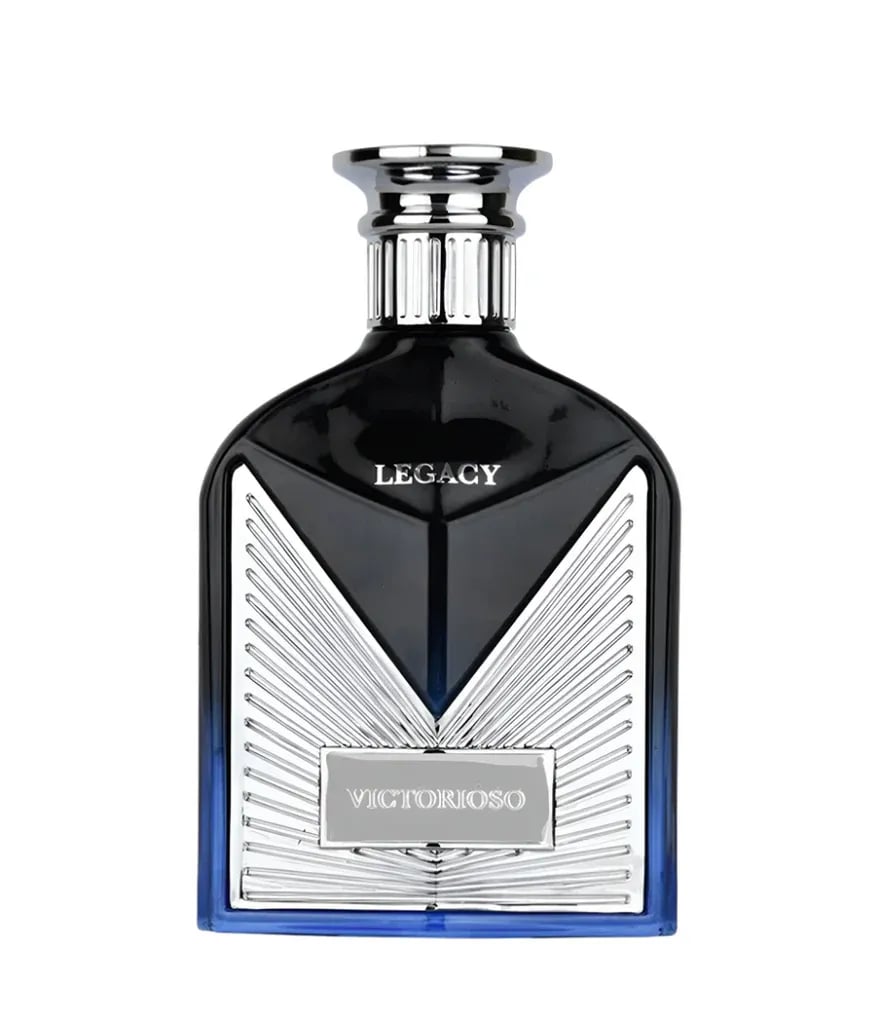 Maison Alhambra Victorioso Legacy — Black glass perfume bottle with silver accents and blue gradient base, next to a white and blue box with radiating lines | Maison Alhambra Victorioso Legacy — Botol minyak wangi kaca hitam dengan aksen perak dan tapak gradien biru, bersebelahan dengan kotak putih dan biru dengan