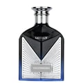Maison Alhambra Victorioso Legacy — Black glass perfume bottle with silver accents and blue gradient base, next to a white and blue box with radiating lines | Maison Alhambra Victorioso Legacy — Botol minyak wangi kaca hitam dengan aksen perak dan tapak gradien biru, bersebelahan dengan kotak putih dan biru dengan