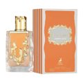 Maison Alhambra Sugar Me Carrot Cake — A clear glass perfume bottle with an orange liquid and gold decorative elements, next to its orange and white striped box with a gold ornate frame containing the product name. | Maison Alhambra Sugar Me Carrot Cake — Botol minyak wangi kaca jernih dengan cecair oren dan elemen