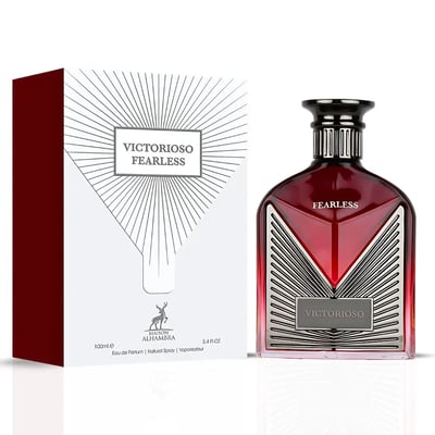 Maison Alhambra Victorioso Fearless by Maison Alhambra 100ml EDP — A red glass perfume bottle with a silver geometric design and a black cap, placed next to its white and red patterned box with the brand logo. | Maison Alhambra Victorioso Fearless by Maison Alhambra 100ml EDP — Botol kaca merah dengan reka bentuk
