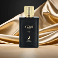 Maison Alhambra Your Touch Oud — A black perfume bottle with a gold cap stands next to its matching black and gold box, both featuring the text 'YOUR TOUCH OUD' and a deer logo. | Maison Alhambra Your Touch Oud — Botol minyak wangi hitam dengan penutup emas berdiri di sebelah kotak hitam dan emasnya, kedua-duanya
