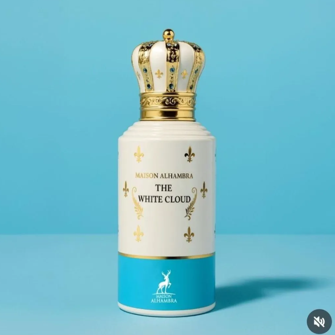 Maison Alhambra The White Cloud — A white perfume bottle with a gold crown cap and blue and gold accents, shown next to its matching blue and white patterned box with gold fleur-de-lis. | Maison Alhambra The White Cloud — Botol minyak wangi putih dengan penutup mahkota emas dan aksen biru serta emas, ditunjukkan di
