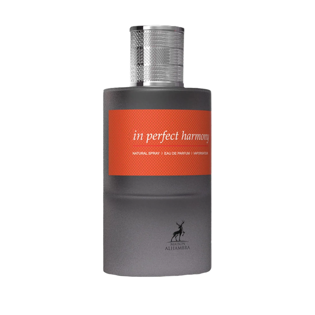 Maison Alhambra In Perfect Harmony 60ml EDP — A grey box and a grey perfume bottle with an orange label featuring the text 'in perfect harmony' are shown against a white background. | Maison Alhambra In Perfect Harmony 60ml EDP — Kotak kelabu dan botol minyak wangi kelabu dengan label oren bertulis 'in perfect
