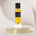 Maison Alhambra Winsome by Maison Alhambra 90ml EDP — A white box with black text and a deer logo sits next to a clear glass perfume bottle with yellow liquid and a black cap, displayed on a black and white tiered stand. | Maison Alhambra Winsome by Maison Alhambra 90ml EDP — Kotak putih dengan teks hitam dan logo