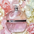 Maison Alhambra Chants Tenderina by Maison Alhambra 100ml EDP — A clear glass perfume bottle with a faceted cap sits next to its pink and white box, both featuring a deer logo and text. | Maison Alhambra Chants Tenderina by Maison Alhambra 100ml EDP — Botol minyak wangi kaca jernih dengan penutup berfacets terletak di