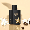 Maison Alhambra Galactic Man Elixir — Black perfume box and bottle with gold star accents and text, set against a white background. | Maison Alhambra Galactic Man Elixir — Kotak dan botol minyak wangi hitam dengan aksen bintang emas dan teks, berlatar belakang putih.