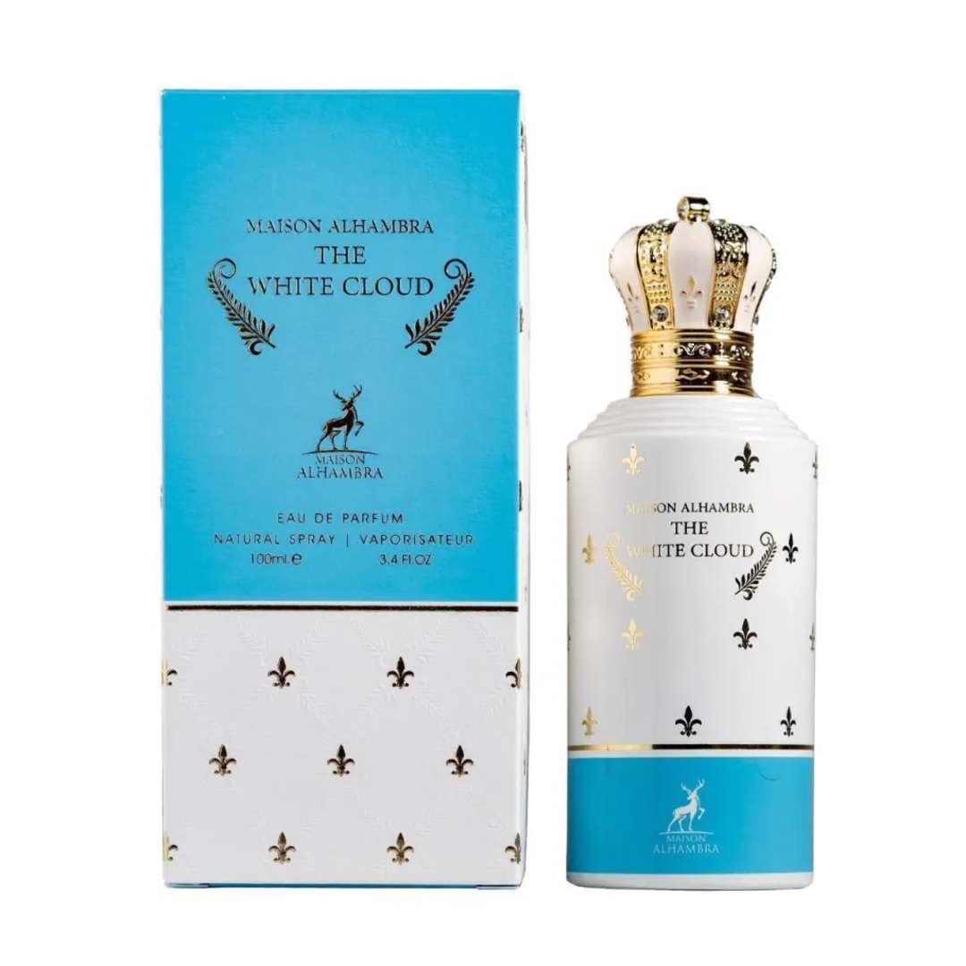 Maison Alhambra The White Cloud — A white perfume bottle with a gold crown cap and blue and gold accents, shown next to its matching blue and white patterned box with gold fleur-de-lis. | Maison Alhambra The White Cloud — Botol minyak wangi putih dengan penutup mahkota emas dan aksen biru serta emas, ditunjukkan di