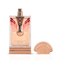 Maison Alhambra La Charmante Eclatant by Maison Alhambra 100ml EDP — A perfume bottle with a decorative fan-like gold and red atomizer sits next to its matching red and gold patterned box. | Maison Alhambra La Charmante Eclatant by Maison Alhambra 100ml EDP — Botol minyak wangi dengan penyembur emas dan merah seperti