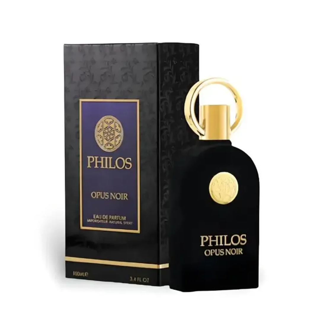 Maison Alhambra Philos Opus Noir by Maison Alhambra 100ml EDP — A black perfume bottle with a gold ring cap and a circular gold emblem on the front, next to its matching black and gold box with the same emblem and text. | Maison Alhambra Philos Opus Noir by Maison Alhambra 100ml EDP — Botol minyak wangi hitam dengan