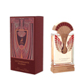Maison Alhambra La Charmante Eclatant by Maison Alhambra 100ml EDP — A perfume bottle with a decorative fan-like gold and red atomizer sits next to its matching red and gold patterned box. | Maison Alhambra La Charmante Eclatant by Maison Alhambra 100ml EDP — Botol minyak wangi dengan penyembur emas dan merah seperti