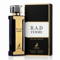 Maison Alhambra B.A.D. Femme Eau de Parfum — A dark blue and gold perfume bottle stands next to its black and gold box, both featuring the B.A.D. Femme logo and a deer emblem. | Maison Alhambra B.A.D. Femme Eau de Parfum — Botol minyak wangi biru gelap dan emas berdiri di sebelah kotak hitam dan emasnya, kedua-duanya