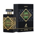 Maison Alhambra Infini Oud Joyous – Black perfume bottle with gold geometric design and green accents, next to its black and gold patterned box with deer logo. | Maison Alhambra Infini Oud Joyous – Botol minyak wangi hitam dengan reka bentuk geometri emas dan aksen hijau, bersebelahan dengan kotak corak hitam dan