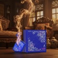 Maison Alhambra Luxe Nightlife Unisex 100 ml — A blue perfume bottle is cracked and emitting purple flames and golden smoke, next to its matching blue box with a starry pattern. | Maison Alhambra Luxe Nightlife Unisex 100 ml — Botol minyak wangi biru retak mengeluarkan api ungu dan asap keemasan, bersebelahan dengan