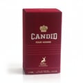 Maison Alhambra Candid Pour Homme — A maroon box with gold crown and deer logo, featuring the text "CANDID POUR HOMME" and "MAISON ALHAMBRA". | Maison Alhambra Candid Pour Homme — Kotak berwarna merah marun dengan logo mahkota emas dan rusa, menampilkan teks "CANDID POUR HOMME" dan "MAISON ALHAMBRA".