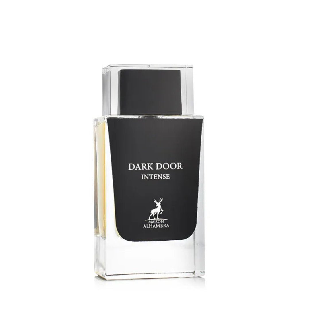 Maison Alhambra Dark Door Intense — A clear glass perfume bottle with a black label and a silver deer logo, against a white background. | Maison Alhambra Dark Door Intense — Botol minyak wangi kaca jernih dengan label hitam dan logo rusa perak, berlatar belakang putih.