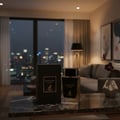 Maison Alhambra Dark Door Intense — A black perfume box and bottle sit on a marble table in front of a window overlooking a city skyline at night. | Maison Alhambra Dark Door Intense — Kotak dan botol minyak wangi hitam diletakkan di atas meja marmar di hadapan tingkap yang menghadap latar langit bandar pada waktu