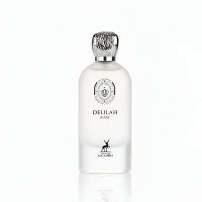 Maison Alhambra Delilah Blanc by Maison Alhambra 100ml EDP — A white frosted glass perfume bottle with a silver patterned cap, featuring a circular emblem and a deer silhouette on the lower half. | Maison Alhambra Delilah Blanc by Maison Alhambra 100ml EDP — Botol kaca putih beku dengan penutup berona perak bermotif