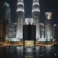 Maison Alhambra Encode By Maison Alhambra 100ml for Man — A glass perfume bottle with a black textured band and a silver cap, set against a blurred nighttime cityscape with illuminated skyscrapers. | Maison Alhambra Encode By Maison Alhambra 100ml for Man — Botol minyak wangi kaca dengan jalur bertekstur hitam dan