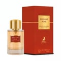 Maison Alhambra Exclusif Rose — A clear glass perfume bottle with a gold cap and a red label sits next to a tall, red, rectangular perfume box with gold lettering and a deer silhouette. | Maison Alhambra Exclusif Rose — Botol minyak wangi kaca jernih dengan penutup emas dan label merah duduk di sebelah kotak minyak