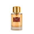 Maison Alhambra Exclusif Rose — A clear glass perfume bottle with a gold cap and a red label featuring gold text. The liquid inside is amber-colored. | Maison Alhambra Exclusif Rose — Botol minyak wangi kaca jernih dengan penutup emas dan label merah bertulis emas. Cecair di dalamnya berwarna ambar.