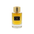 Maison Alhambra Exclusif Oud — A clear glass perfume bottle with golden cap and a black label reading "EXCLUSIF OUD MAISON ALHAMBRA COLLECTION". The liquid inside is amber-colored. | Botol minyak wangi kaca jernih dengan penutup emas dan label hitam bertuliskan "EXCLUSIF OUD MAISON ALHAMBRA COLLECTION". Cecair di
