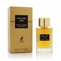 Maison Alhambra Exclusif Oud — A gold box and a clear glass perfume bottle with a gold cap are displayed against a white background. The bottle contains amber-colored liquid. | Maison Alhambra Exclusif Oud — Kotak emas dan botol minyak wangi kaca jernih dengan penutup emas dipamerkan berlatarkan latar putih. Botol