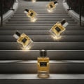 Maison Alhambra Exclusif Oud by Maison Alhambra 100 ml Unisex — Several perfume bottles falling down marble stairs with golden sparks | Maison Alhambra Exclusif Oud by Maison Alhambra 100 ml Unisex — Beberapa botol minyak wangi jatuh menuruni tangga marmar dengan percikan keemasan