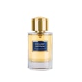 Maison Alhambra Exclusif Saffron — A clear glass perfume bottle with a golden cap and a blue label reading "EXCLUSIF SAFFRON" and "MAISON ALHAMBRA COLLECTION". | Maison Alhambra Exclusif Saffron — Botol minyak wangi kaca jernih dengan penutup keemasan dan label biru bertuliskan "EXCLUSIF SAFFRON" dan "MAISON ALHAMBRA