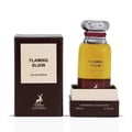 Maison Alhambra Flaming Elixir — A bottle of amber and burgundy Eau de Parfum stands next to its matching burgundy box with a white label. | Maison Alhambra Flaming Elixir — Sebotol Eau de Parfum berwarna kuning dan burgundy berdiri di sebelah kotak burgundy yang sepadan dengan label putih.