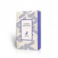Maison Alhambra Flower Addiction by Maison Alhambra for Him 100ml — A white perfume box with a geometric pattern of blue and beige lines, featuring a central label with the text "FLOWER ADDICTION EAU DE PARFUM" and a deer silhouette above "MAISON ALHAMBRA" | Maison Alhambra Flower Addiction by Maison Alhambra for Him
