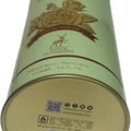 Maison Alhambra Glacier Bella EDP 100ml Women Perfume Maison Alhambra — Close-up of a light green perfume can with gold accents, featuring a floral design and text. | Maison Alhambra Glacier Bella EDP 100ml Women Perfume Maison Alhambra — Pandangan dekat tin minyak wangi hijau muda dengan perincian emas, menampilkan