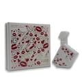 Maison Alhambra Luxe Chic – White perfume box and bottle decorated with red hearts and lips, with the word "LUXE" prominently displayed. | Maison Alhambra Luxe Chic – Kotak dan botol minyak wangi putih dihiasi dengan hati merah dan bibir, dengan perkataan "LUXE" dipaparkan dengan ketara.