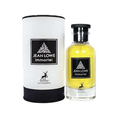 Maison Alhambra Jean Lowe Immortel — A cylindrical white and black box stands next to a clear glass perfume bottle filled with yellow liquid, both featuring a black label with a deer silhouette and text. | Maison Alhambra Jean Lowe Immortel — Kotak silinder putih dan hitam berdiri di sebelah botol minyak wangi kaca