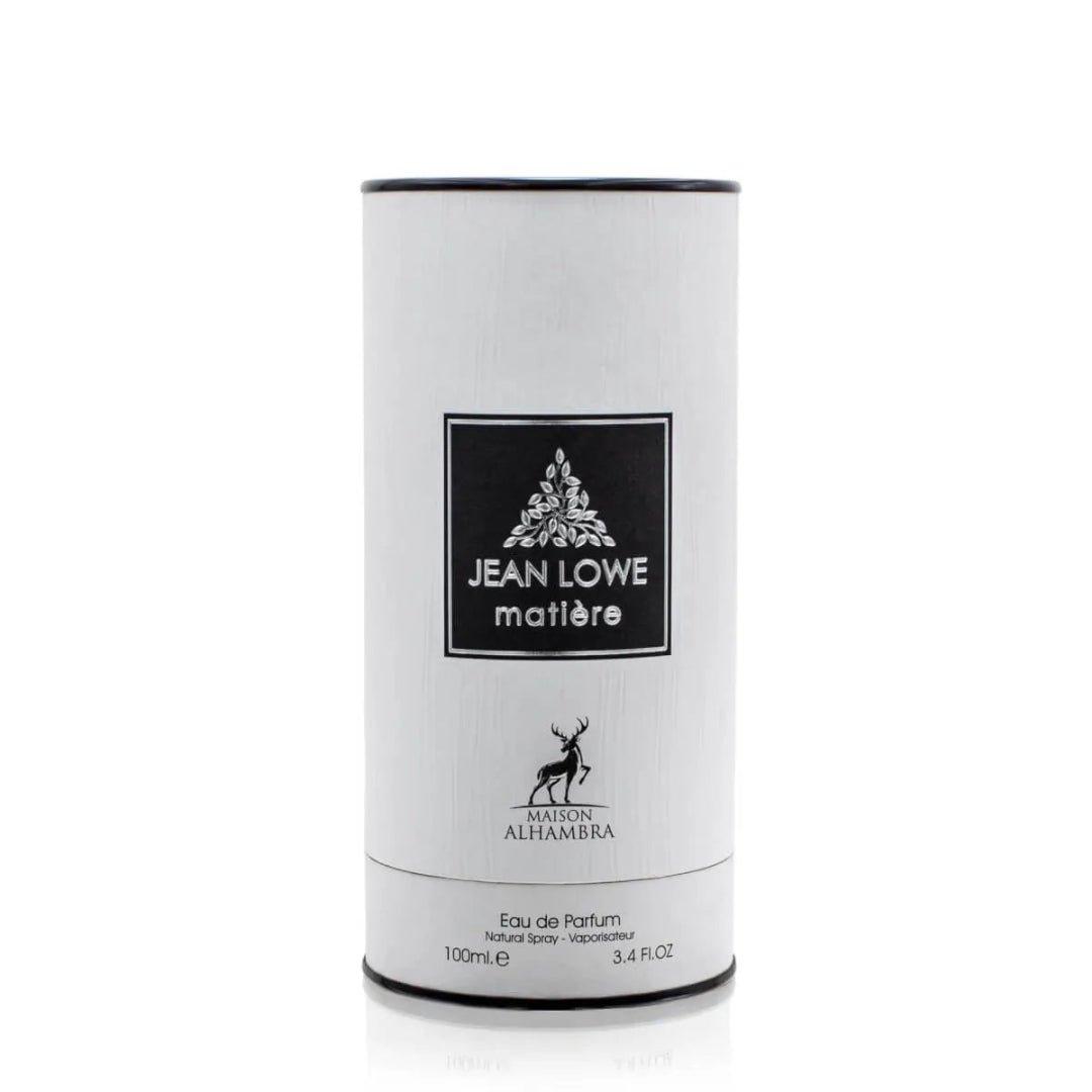 Maison Alhambra Jean Lowe Matiere — White cylindrical perfume packaging with black trim and a black label featuring text and a botanical illustration. | Pembungkusan minyak wangi silinder putih dengan trim hitam dan label hitam yang menampilkan teks dan ilustrasi botani.