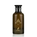 Maison Alhambra Jean Lowe Noir — A dark brown glass perfume bottle with a black cap and gold accents, featuring a gold leaf emblem and a deer silhouette. | Maison Alhambra Jean Lowe Noir — Botol kaca berwarna coklat gelap dengan penutup hitam dan aksen emas, menampilkan lambang daun emas dan siluet rusa.