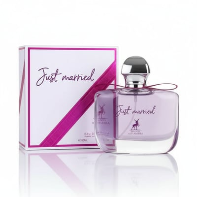 Maison Alhambra Just Married by Maison Alhambra Woman 100ml — A white box with a pink ribbon and the text "Just married" is placed next to a clear glass perfume bottle with purple liquid and a silver cap, also featuring the "Just married" text and a deer logo. | Maison Alhambra Just Married by Maison Alhambra Woman