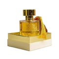 Maison Alhambra Anarch by Maison Alhambra 100ml EDP Women — A clear glass perfume bottle with golden liquid and intricate gold detailing on the front, resting on a two-tiered gold and cream box, with a gold tassel hanging from the cap. | Maison Alhambra Anarch by Maison Alhambra 100ml EDP Women — Botol minyak wangi