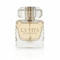 Maison Alhambra La Vita EDP — A clear glass perfume bottle with a faceted geometric design on the sides and a faceted clear cap. The liquid inside is pale yellow. A small deer silhouette is printed on the front. | Maison Alhambra La Vita EDP — Botol kaca jernih dengan rekaan geometri berfaset di sisi dan penutup