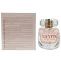 Maison Alhambra La Vita 100ml EDP Women — A light pink perfume bottle with a crystal cap sits next to its matching box, which has text in English and Arabic. | Maison Alhambra La Vita 100ml EDP Women — Botol minyak wangi merah jambu terang dengan penutup kristal duduk di sebelah kotak yang sepadan, yang mempunyai teks