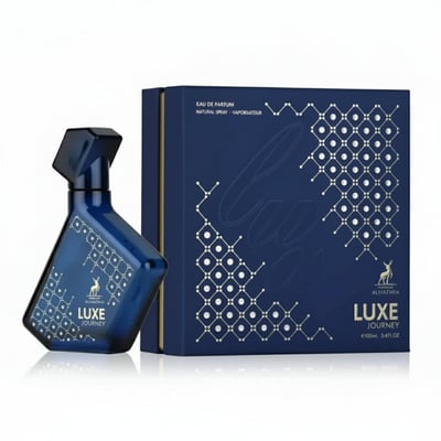 Maison Alhambra Luxe Journey – Blue geometric patterned perfume bottle next to a dark blue box with geometric pattern and text | Maison Alhambra Luxe Journey – Botol minyak wangi biru bercorak geometri di sebelah kotak biru gelap dengan corak geometri dan teks
