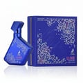 Maison Alhambra Luxe Nightlife — A blue perfume bottle with a white dotted pattern and the brand logo, placed next to its matching blue box with a similar dotted pattern and the word 'Luxe' in script. | Maison Alhambra Luxe Nightlife — Botol minyak wangi biru dengan corak titik putih dan logo jenama, diletakkan di