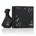 Maison Alhambra Luxe Street by Maison Alhambra – 100 ml Unisex — Black textured perfume bottle and matching black box with rose gold floral accents and text, displayed on a reflective surface. | Maison Alhambra Luxe Street by Maison Alhambra – 100 ml Unisex — Botol minyak wangi bertekstur hitam dan kotak hitam yang