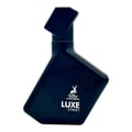 Maison Alhambra Luxe Street — A dark blue, angular perfume bottle with a geometric pattern and a deer logo, featuring the text 'MAISON ALHAMBRA LUXE STREET'. | Maison Alhambra Luxe Street — Botol minyak wangi biru gelap bersudut dengan corak geometri dan logo rusa, memaparkan teks 'MAISON ALHAMBRA LUXE STREET'.