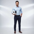 Maison Alhambra Dark Door Sport Men 100ml EDP — Man in light blue shirt and navy pants holding a white box and a black perfume bottle | Maison Alhambra Dark Door Sport Men 100ml EDP — Lelaki berbaju biru muda dan seluar navy memegang kotak putih dan botol minyak wangi hitam