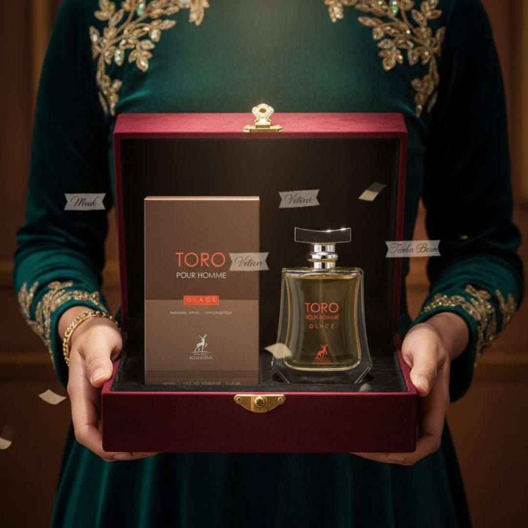 Maison Alhambra Toro Pour Homme Glace – A man's hand presents a luxurious gift box containing a perfume bottle and its matching box, with decorative gold embroidery on a green velvet dress. | Maison Alhambra Toro Pour Homme Glace – Tangan lelaki membentangkan kotak hadiah mewah yang mengandungi botol minyak wangi dan
