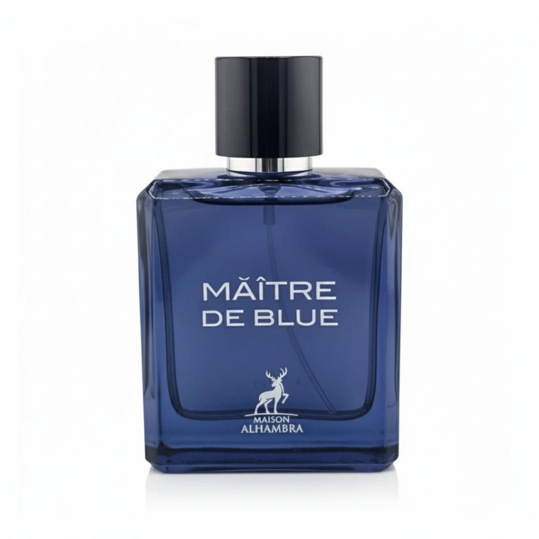 Maison Alhambra Maitre De Blue by Maison Alhambra 100ml for Men — A blue glass perfume bottle with a black cap, featuring white text "MAÎTRE DE BLUE" and a deer logo with "MAISON ALHAMBRA" below. | Maison Alhambra Maitre De Blue by Maison Alhambra 100ml for Men — Botol kaca biru dengan penutup hitam, menampilkan teks