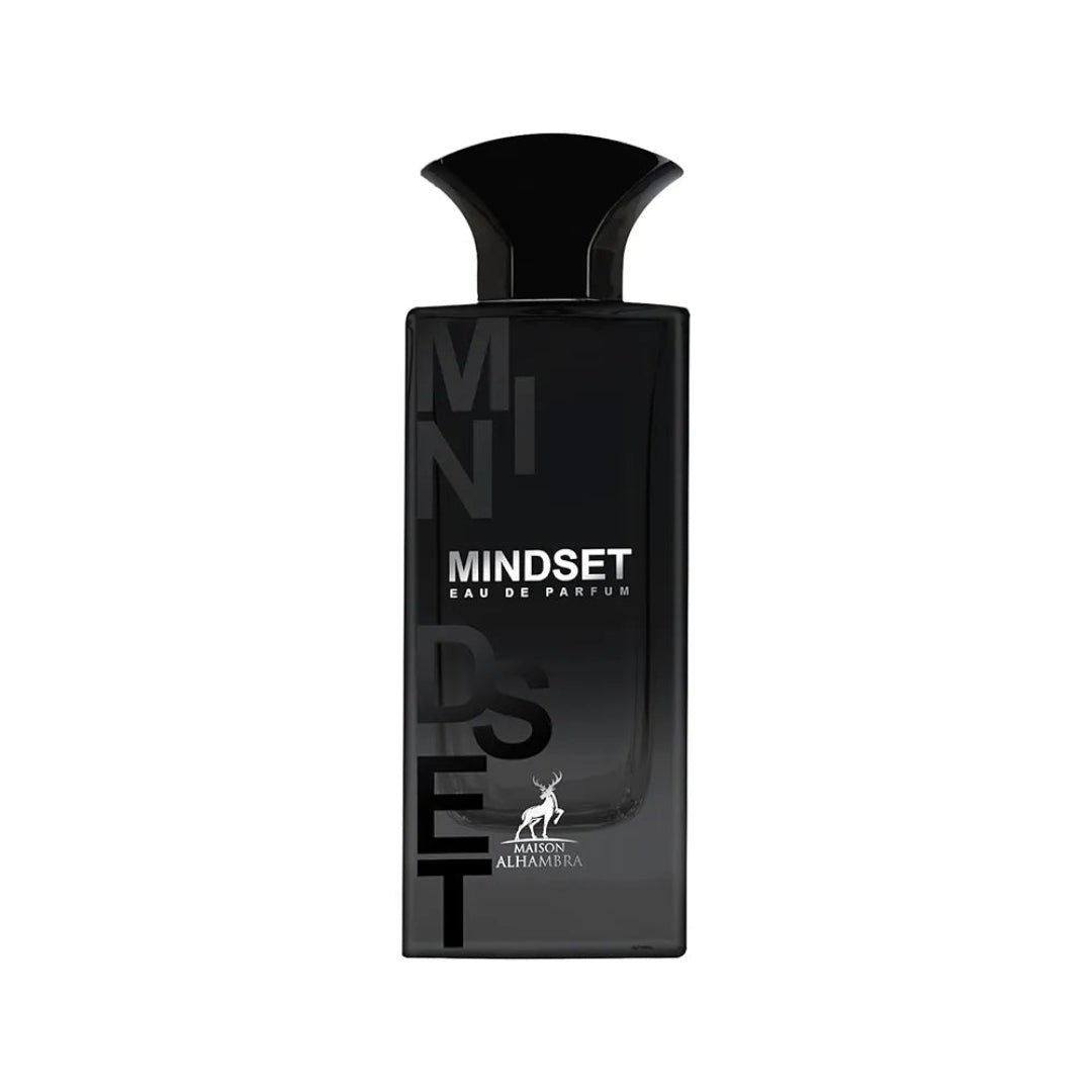 Maison Alhambra Mindset Eau de Parfum — A black perfume bottle and its white and black patterned box are displayed against a white background. The box features bold black lettering for 'MINDSET' and a deer logo. | Maison Alhambra Mindset Eau de Parfum — Botol minyak wangi hitam dan kotaknya yang bercorak hitam putih
