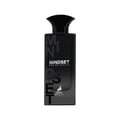 Maison Alhambra Mindset Eau de Parfum — A black perfume bottle and its white and black patterned box are displayed against a white background. The box features bold black lettering for 'MINDSET' and a deer logo. | Maison Alhambra Mindset Eau de Parfum — Botol minyak wangi hitam dan kotaknya yang bercorak hitam putih